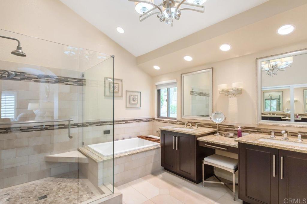 9369 Quail Canyon Road El Cajon, CA 92021 - Photo 29 of 43 a bathroom with a tub a sink and mirrors