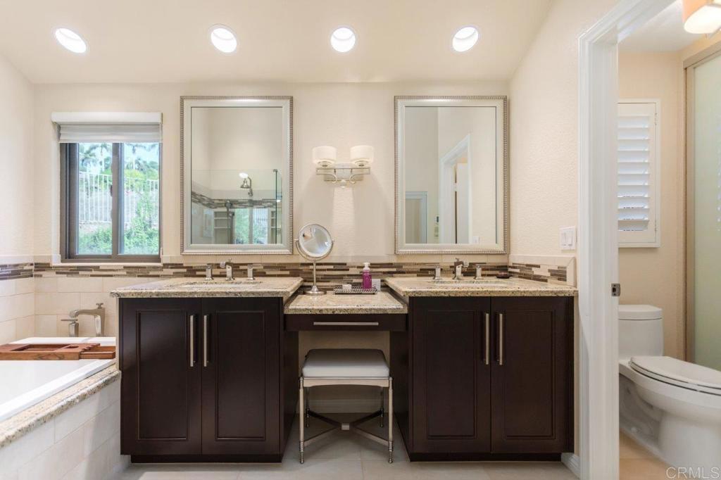 9369 Quail Canyon Road El Cajon, CA 92021 - Photo 30 of 43 a kitchen with a sink stove and cabinets