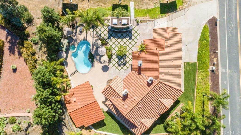 9369 Quail Canyon Road El Cajon, CA 92021 - Photo 3 of 43 a view of a balcony with chairs and potted plant