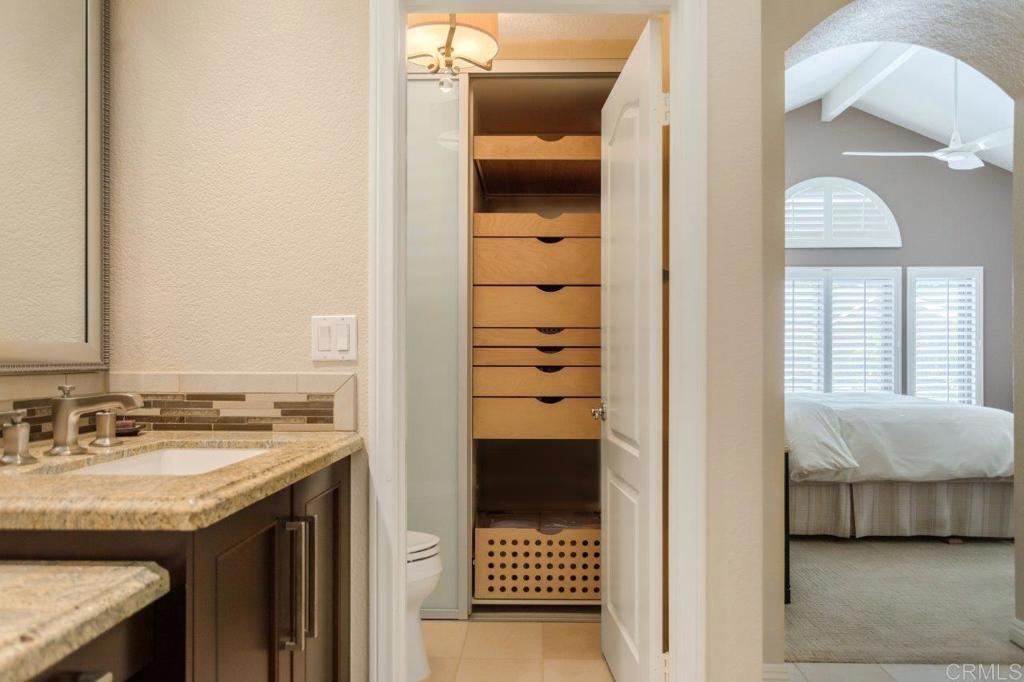 9369 Quail Canyon Road El Cajon, CA 92021 - Photo 31 of 43 a en suite bathroom with a sink and a mirror