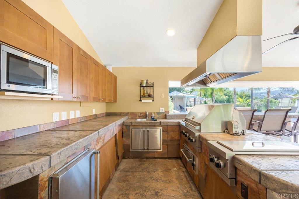 9369 Quail Canyon Road El Cajon, CA 92021 - Photo 36 of 43 a kitchen with a sink and cabinets