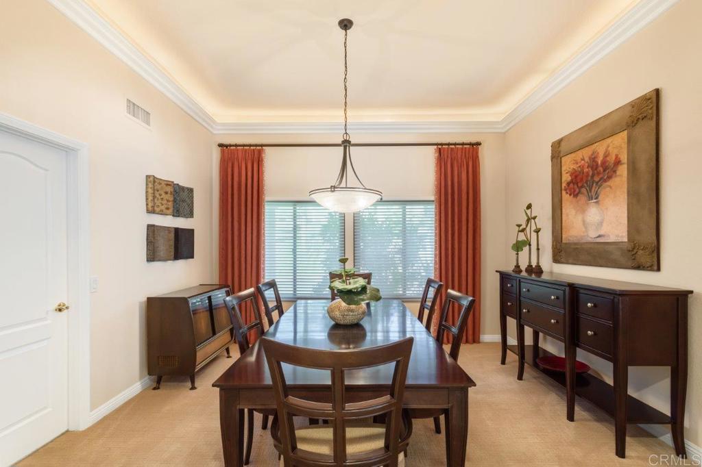 9369 Quail Canyon Road El Cajon, CA 92021 - Photo 10 of 43 a dining room with furniture a chandelier and window