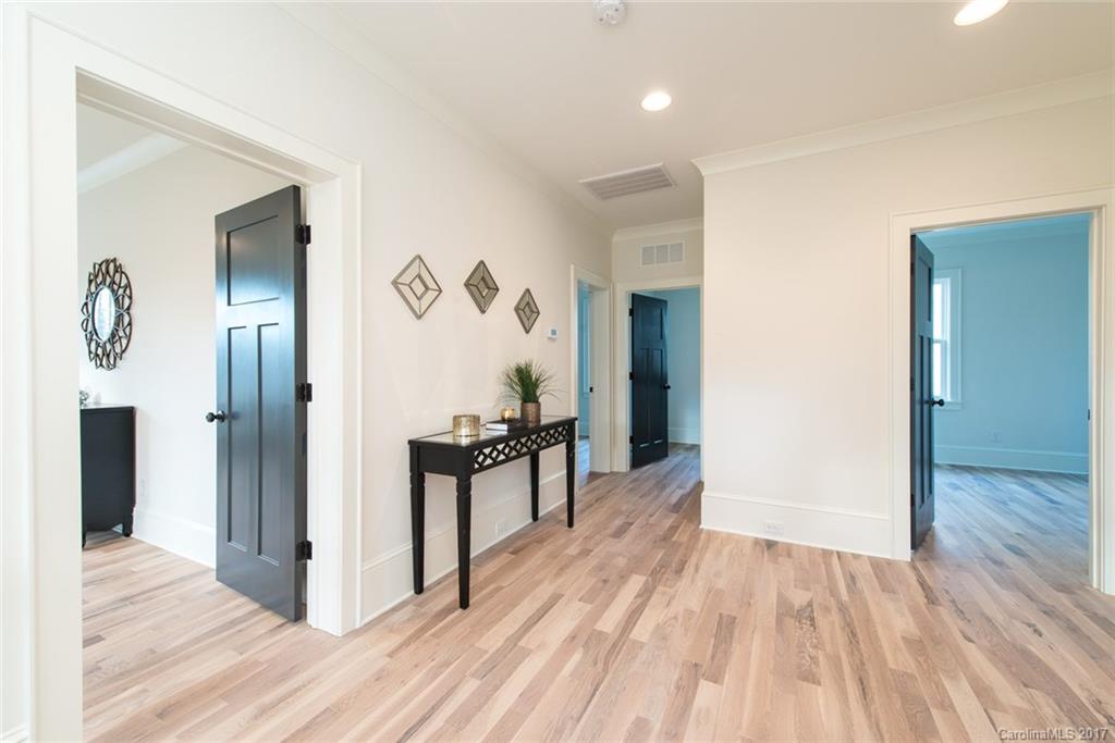 501 McAlway Road Charlotte, NC 28211 - Photo 14 of 24 a view of a hallway view with wooden floor and furniture