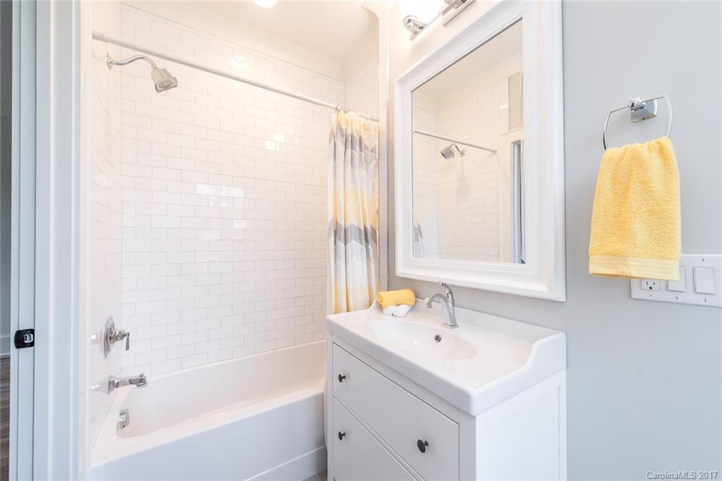501 McAlway Road Charlotte, NC 28211 - Photo 15 of 24 a bathroom with a tub sink and mirror