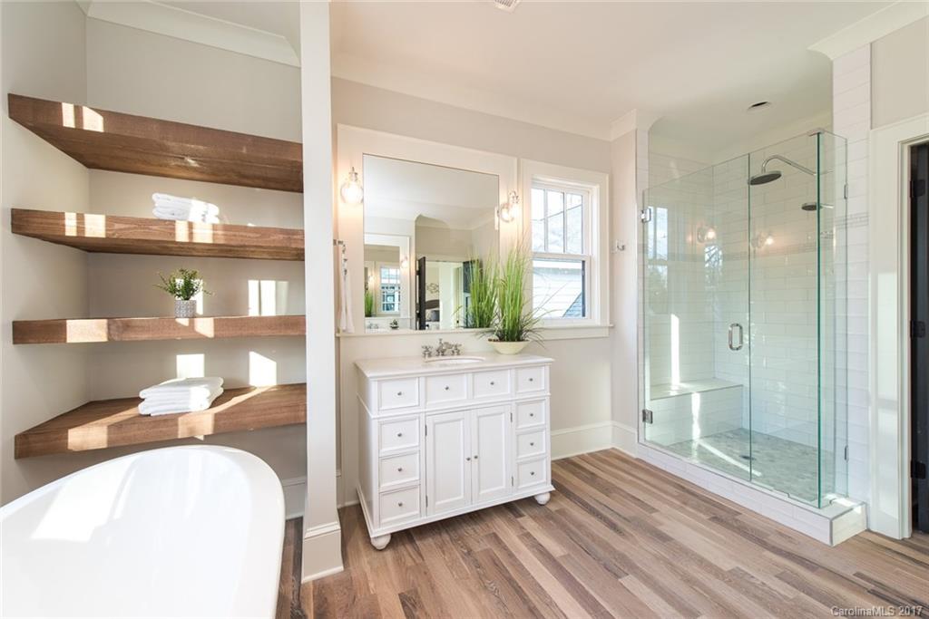 501 McAlway Road Charlotte, NC 28211 - Photo 20 of 24 a bathroom with a granite countertop sink mirror and shower