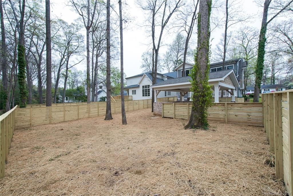 501 McAlway Road Charlotte, NC 28211 - Photo 24 of 24 a view of a house with a backyard and trees