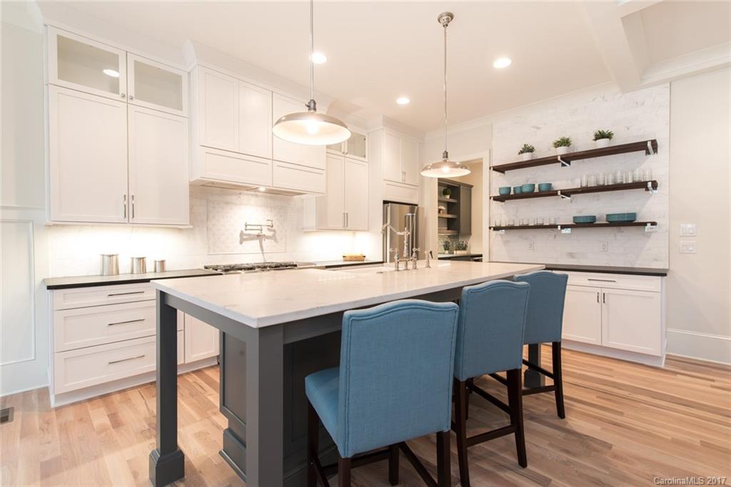 501 McAlway Road Charlotte, NC 28211 - Photo 6 of 24 a kitchen with a sink cabinets and wooden floor