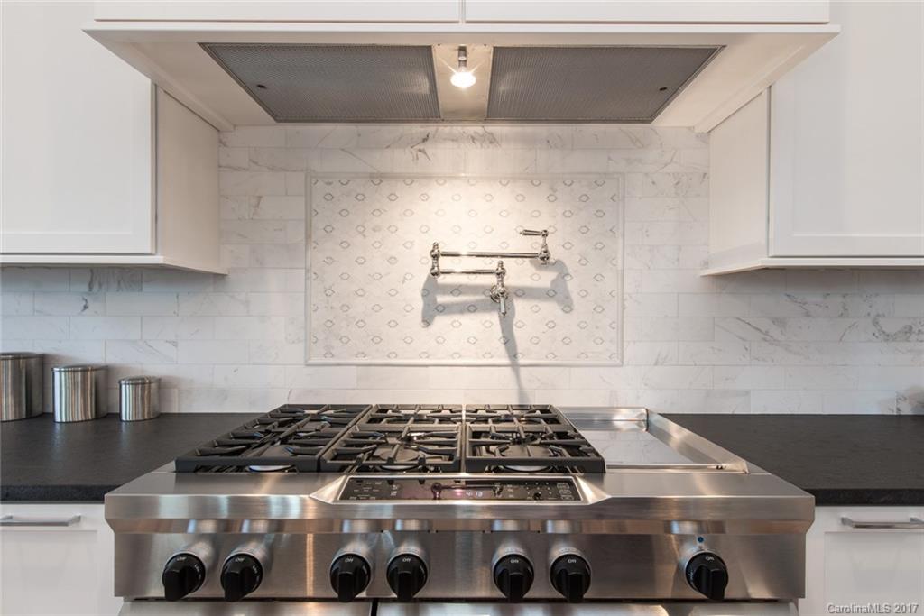 501 McAlway Road Charlotte, NC 28211 - Photo 7 of 24 a stove top oven sitting inside of a kitchen