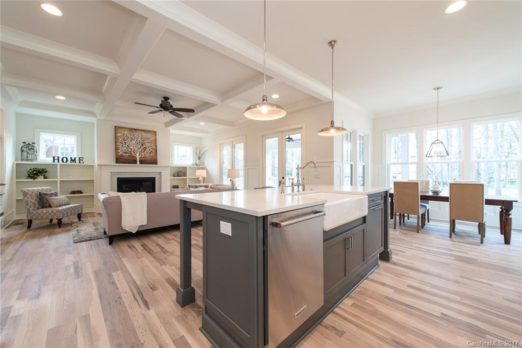 501 McAlway Road Charlotte, NC 28211 - Photo 9 of 24 a kitchen with stainless steel appliances granite countertop a lot of cabinets and wooden floor