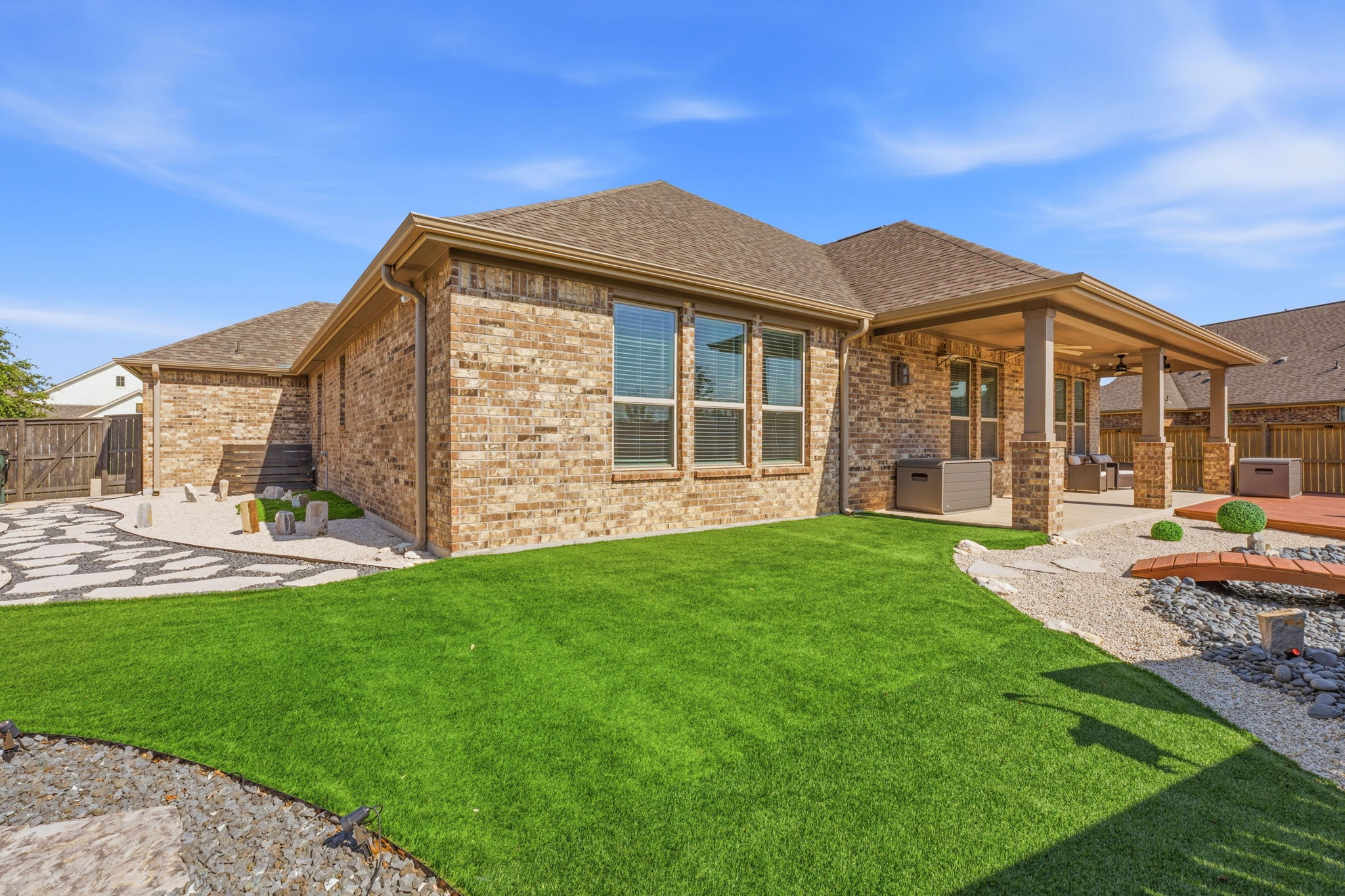 12616 Twisted Root Drive Manchaca, TX 78652 - Photo 29 of 36 This backyard was designed to disappear into with just the right amount of turf lawn and sustainable rock gardens.