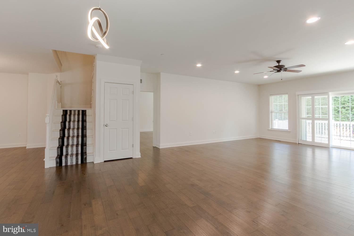 151 Rushcliffe Street State College, PA 16803 - Photo 11 of 50 a view of an empty room with a window and wooden floor
