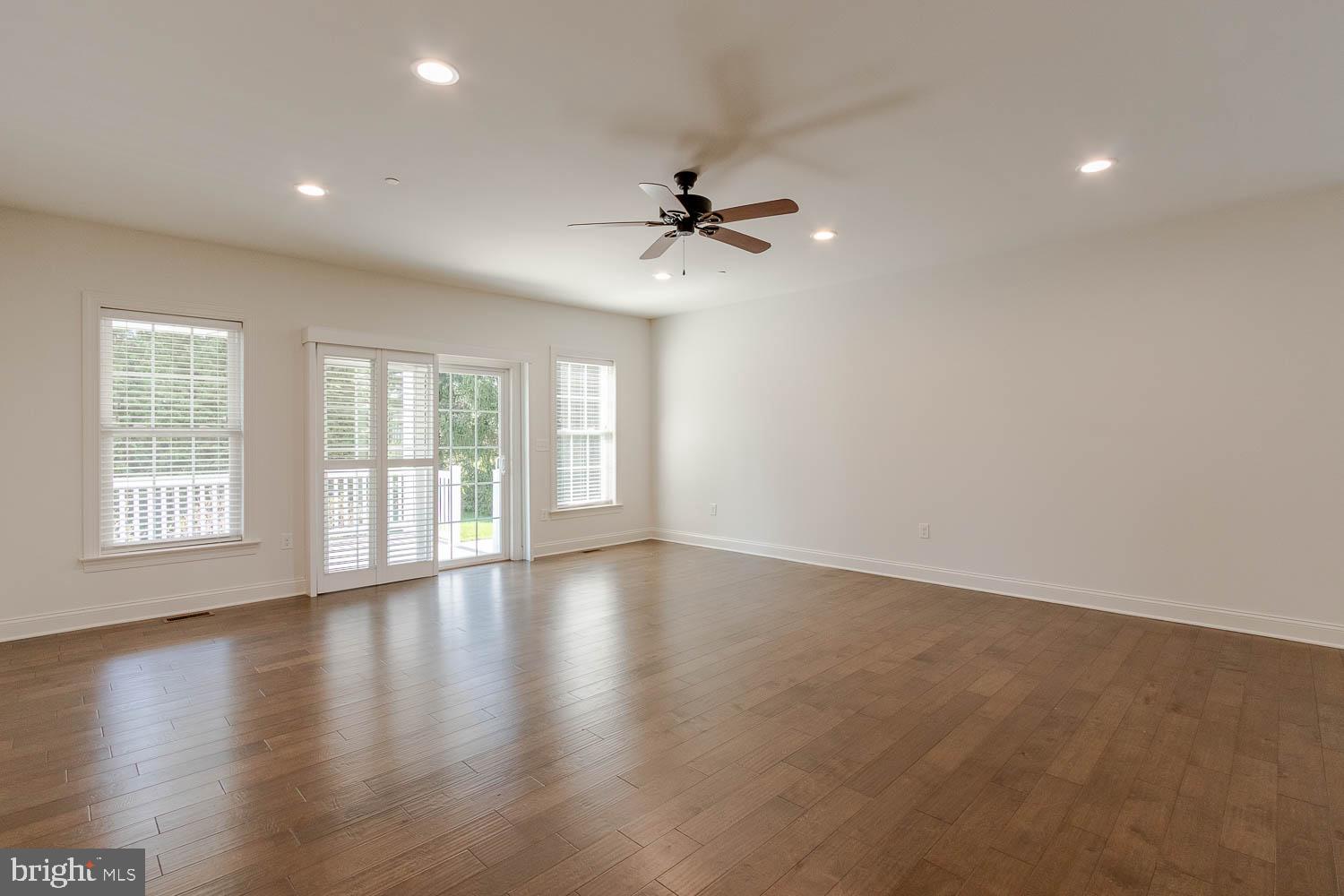 151 Rushcliffe Street State College, PA 16803 - Photo 13 of 50 a view of an empty room with a window and wooden floor
