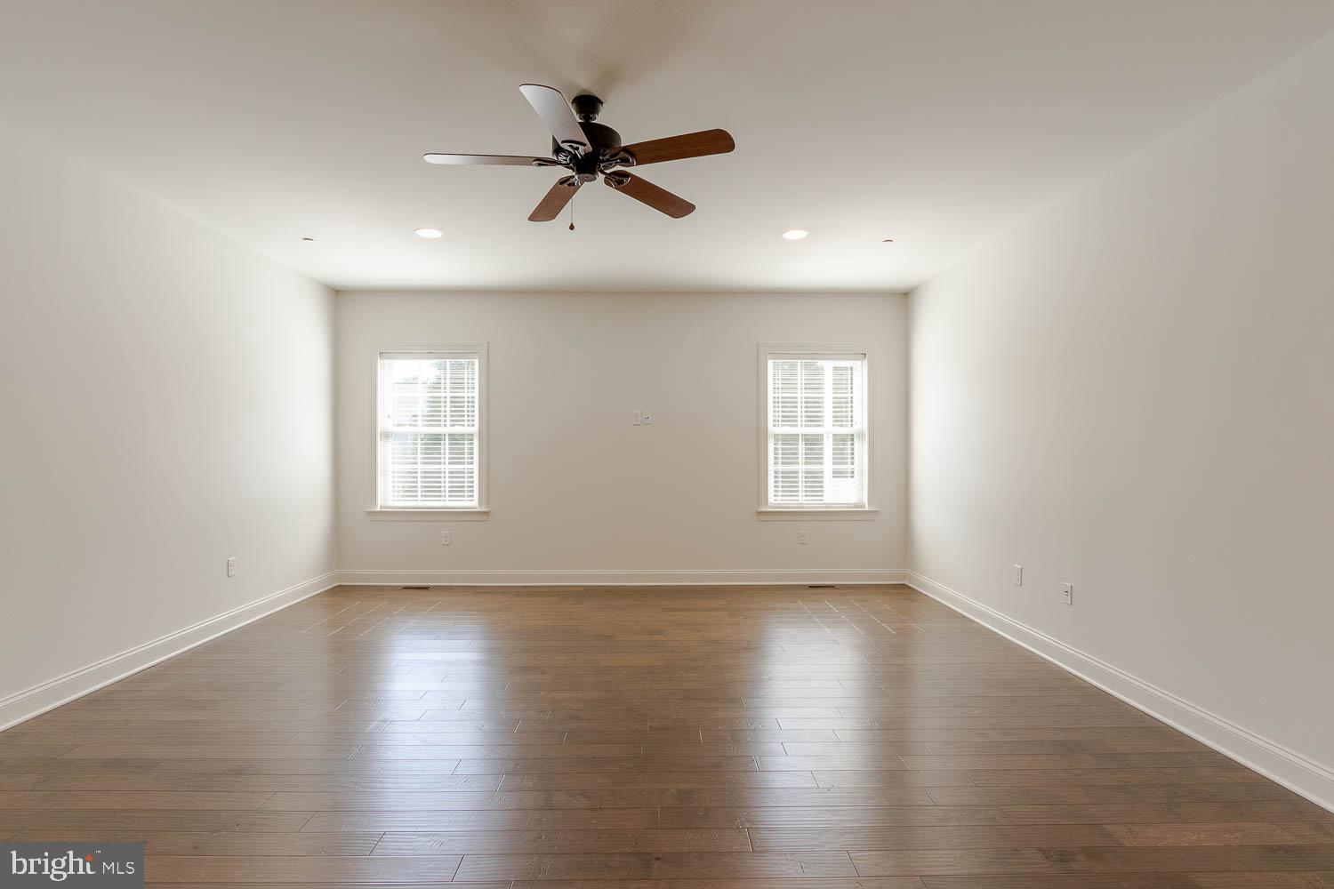 151 Rushcliffe Street State College, PA 16803 - Photo 15 of 50 a view of empty room with wooden floor and fan