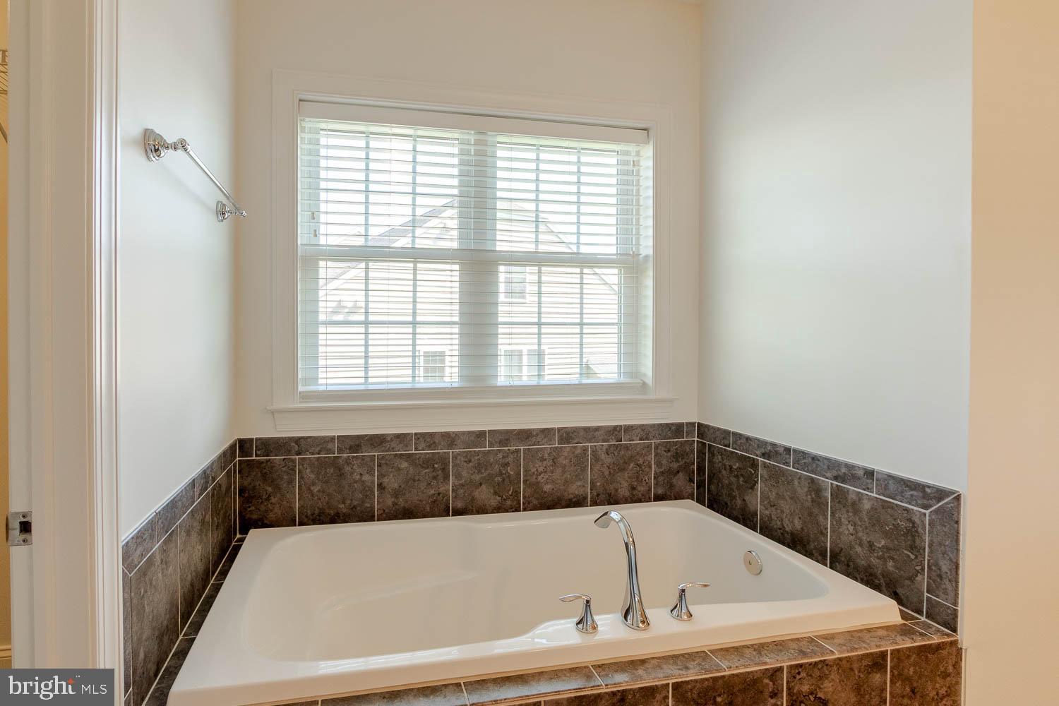 151 Rushcliffe Street State College, PA 16803 - Photo 19 of 50 a bathroom with a bathtub and window