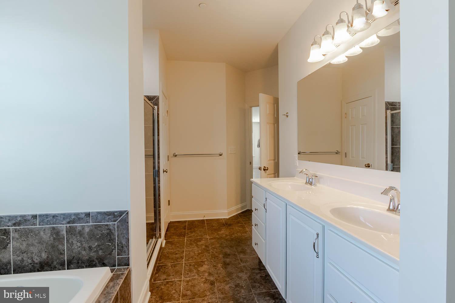 151 Rushcliffe Street State College, PA 16803 - Photo 21 of 50 a spacious bathroom with a tub sink and mirror