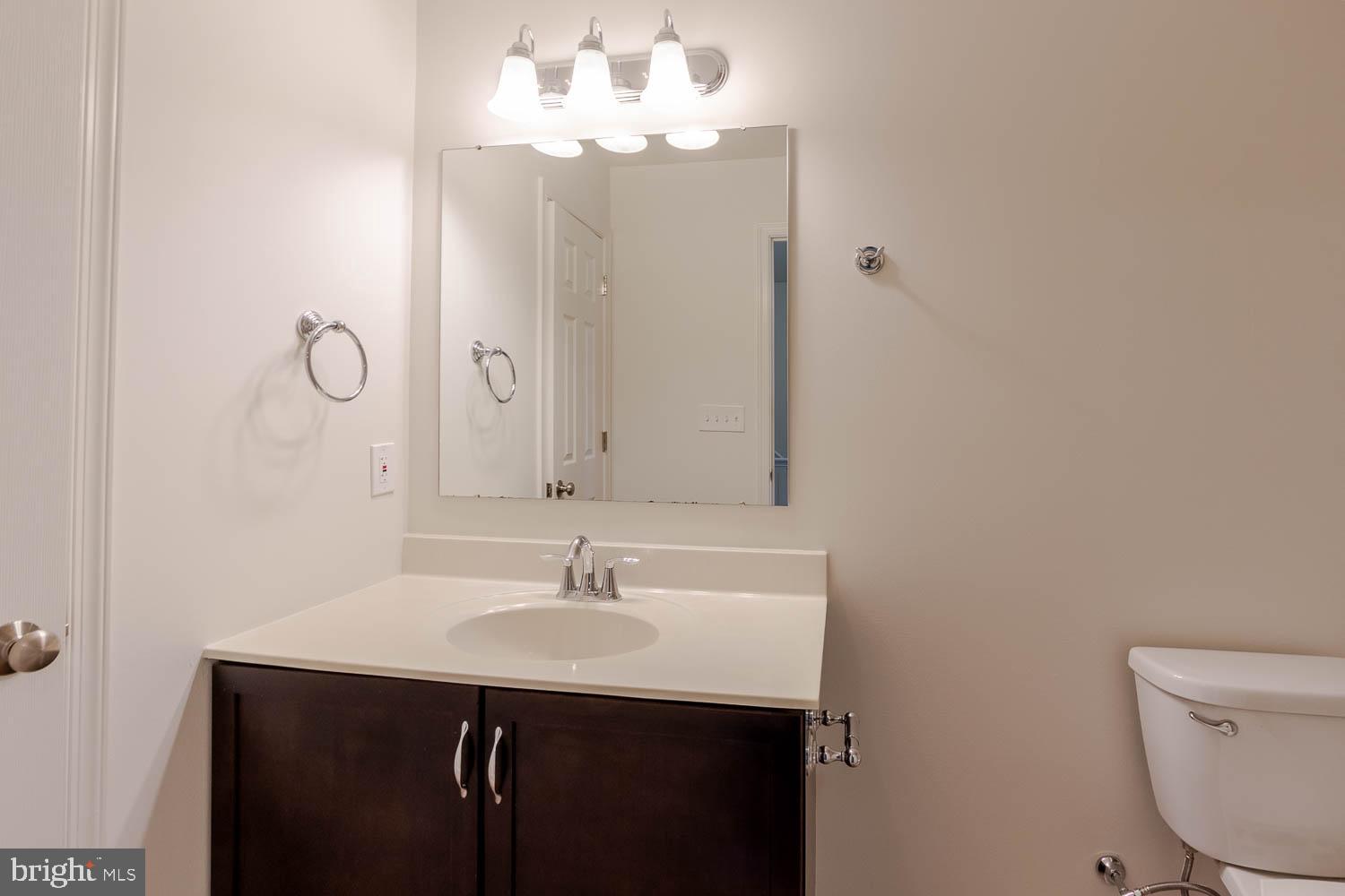 151 Rushcliffe Street State College, PA 16803 - Photo 32 of 50 a bathroom with a sink vanity and a mirror