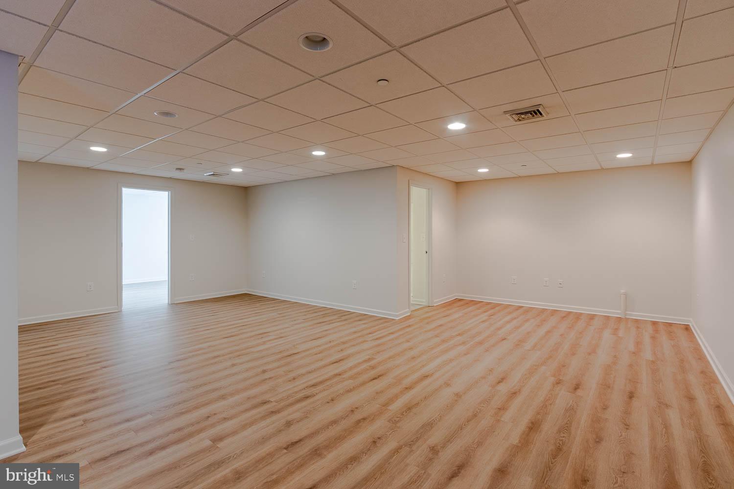 151 Rushcliffe Street State College, PA 16803 - Photo 40 of 50 a view of an empty room with wooden floor