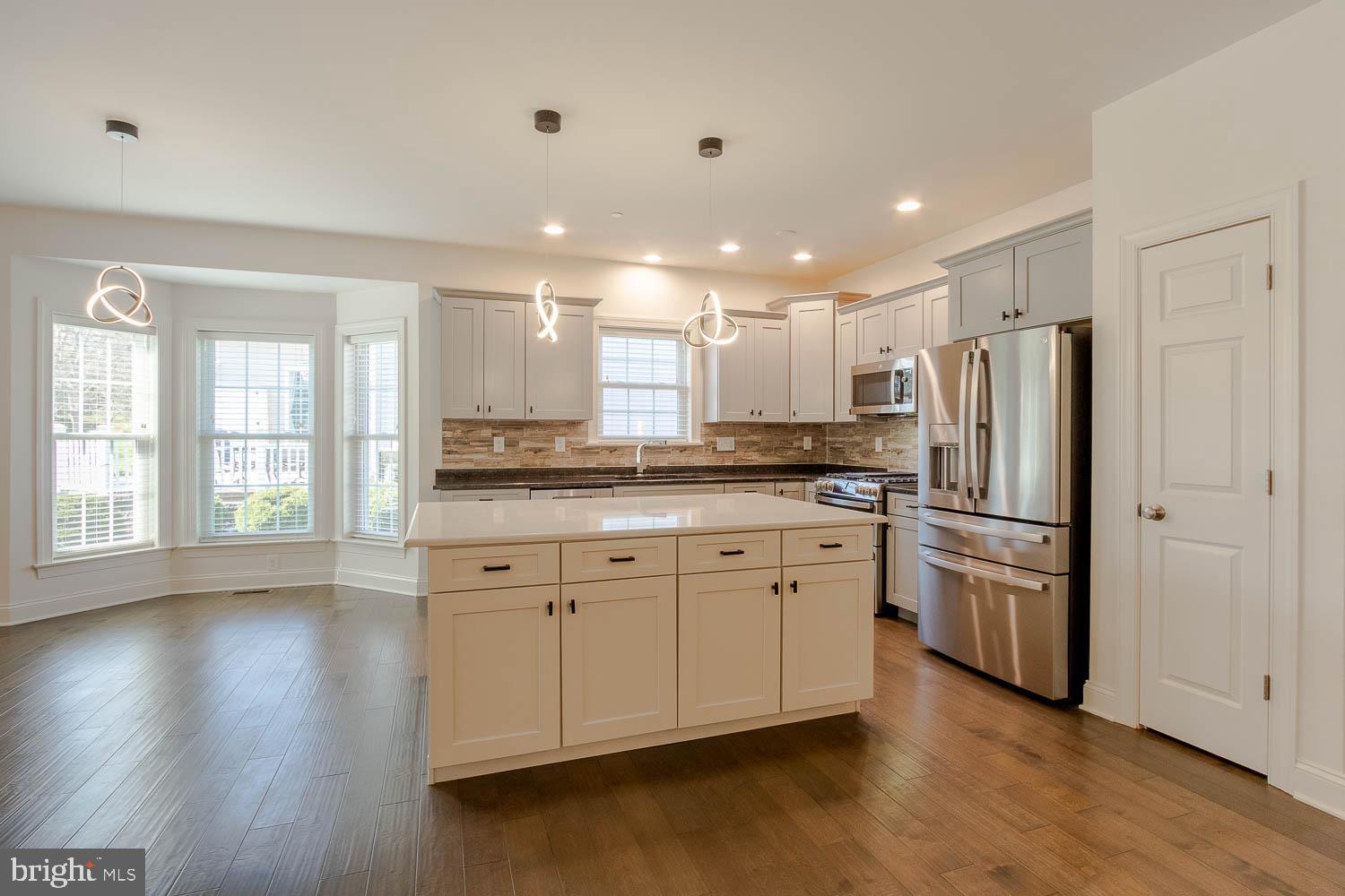 151 Rushcliffe Street State College, PA 16803 - Photo 7 of 50 a kitchen with stainless steel appliances granite countertop a refrigerator and a stove top oven