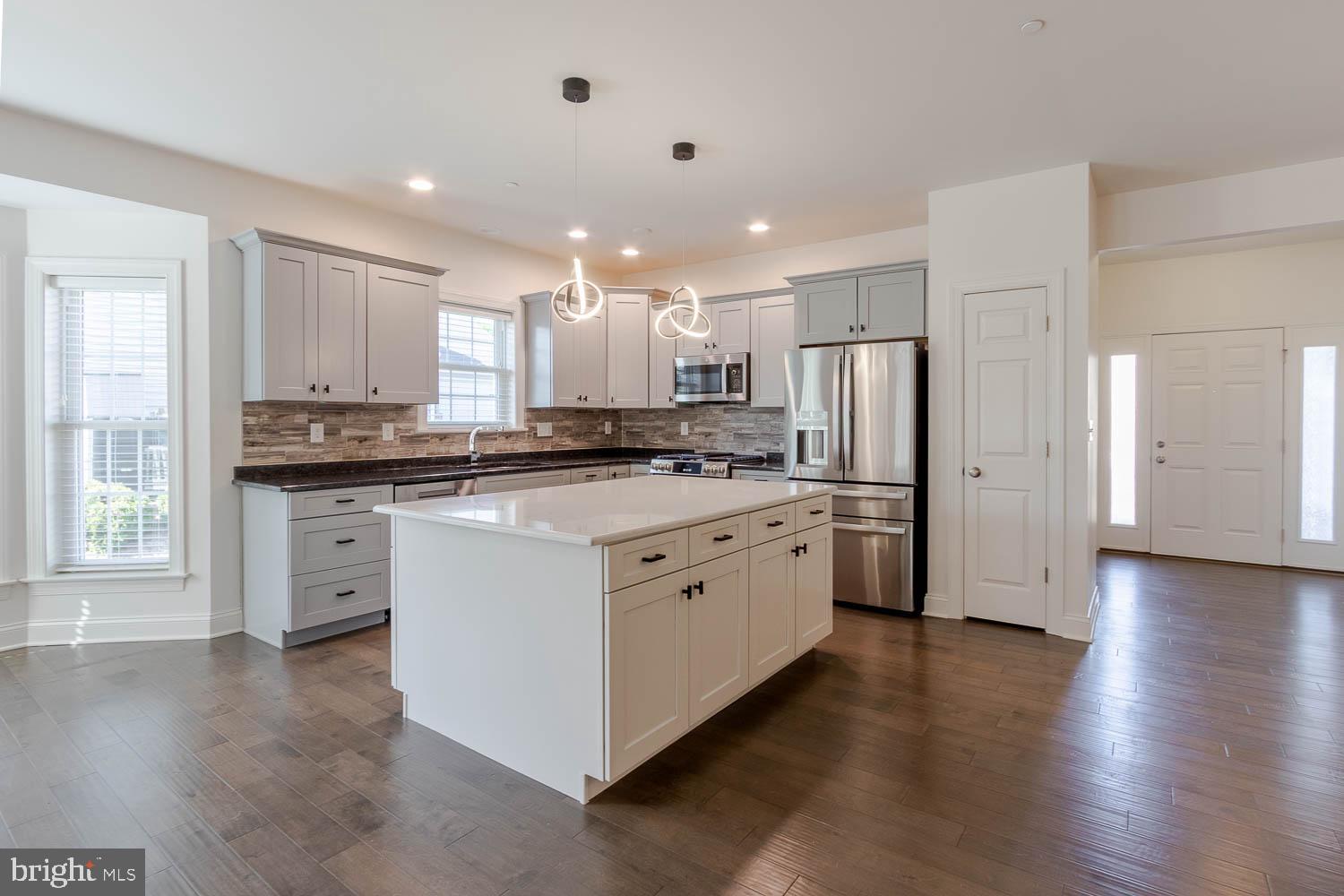 151 Rushcliffe Street State College, PA 16803 - Photo 10 of 50 a kitchen with white cabinets and stainless steel appliances