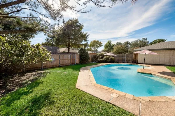 a view of a backyard with a garden