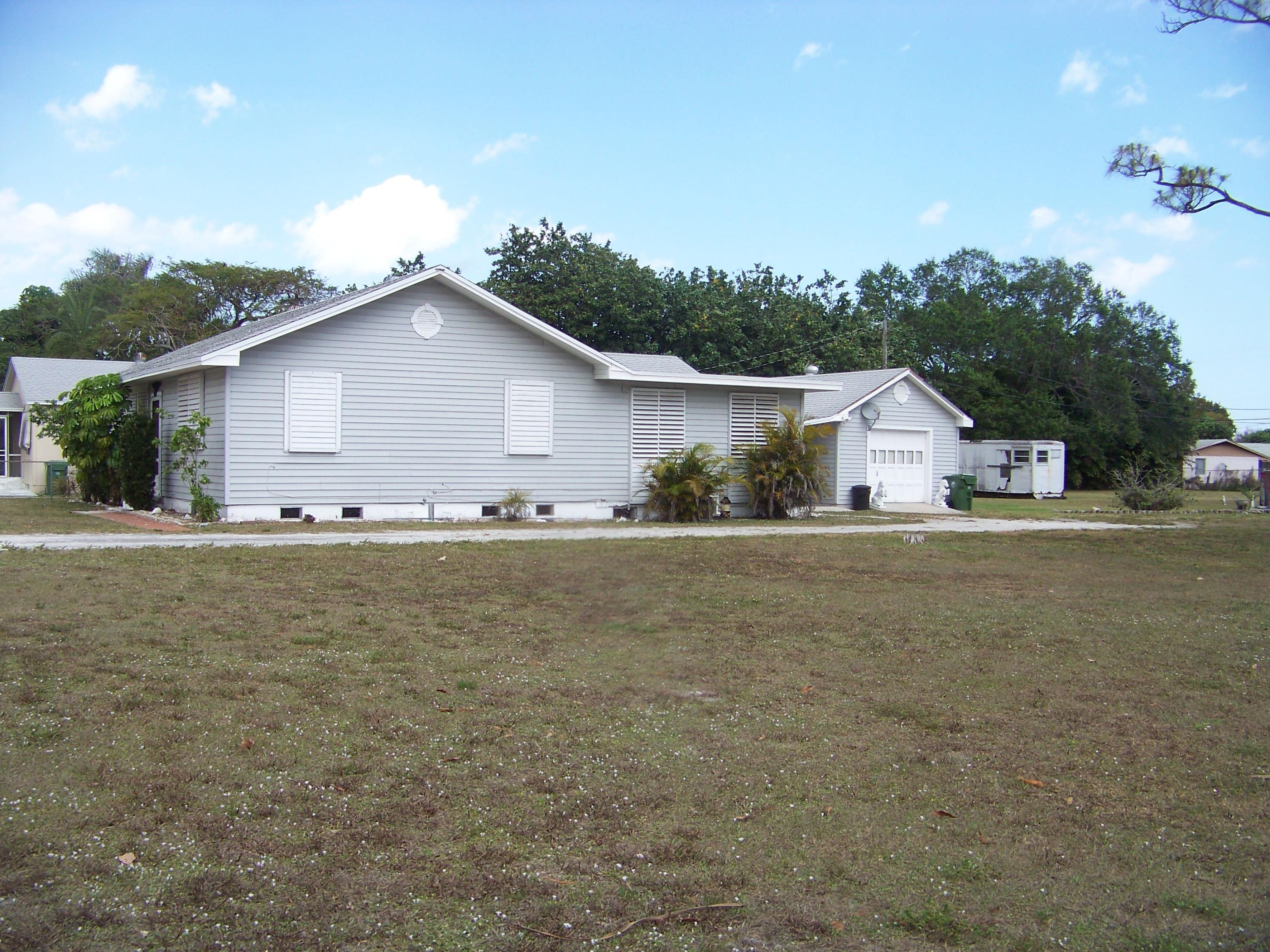 3864 Gulfstream Road Palm Springs, FL 33461 - Photo 13 of 33 3838 House & Garage