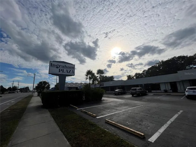 a view of a street with cars on the road