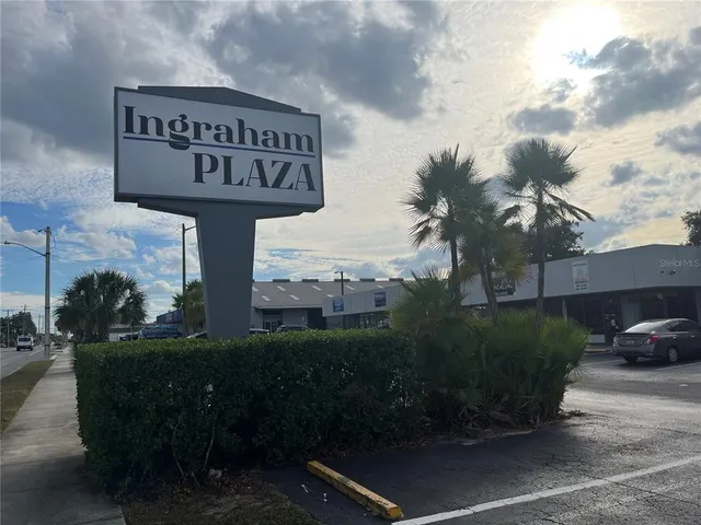 a view of a street with a building in the background