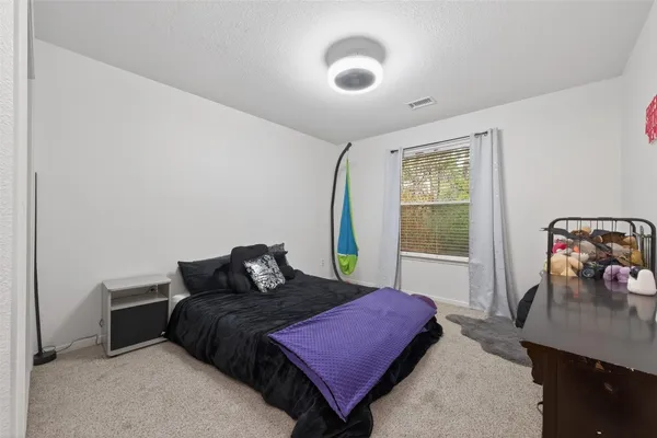 a small hurt is sitting in the middle of a backyard