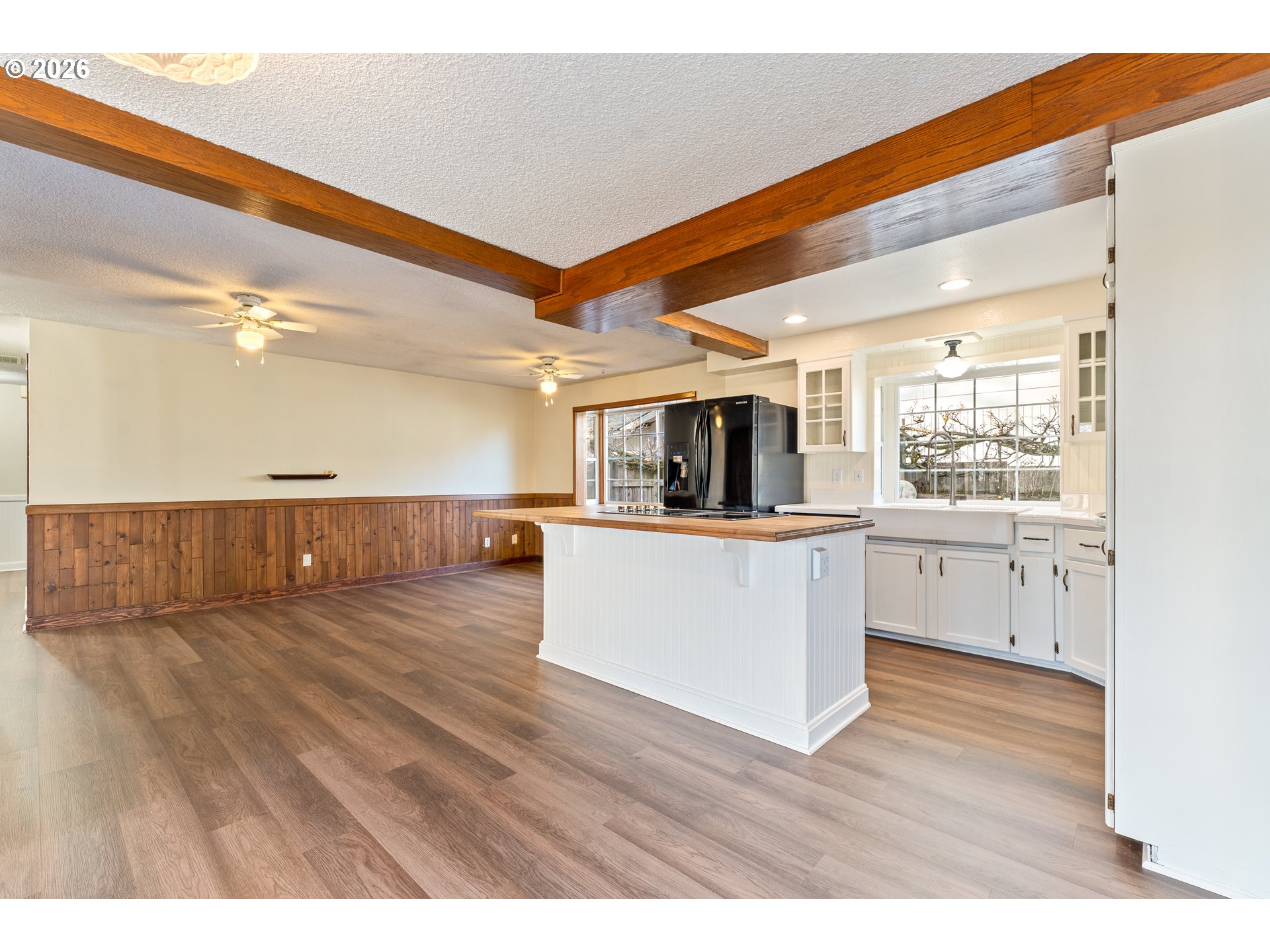 624 South 12th Street St. Helens, OR 97051 - Photo 11 of 45 a view of living room with kitchen island with wooden floor