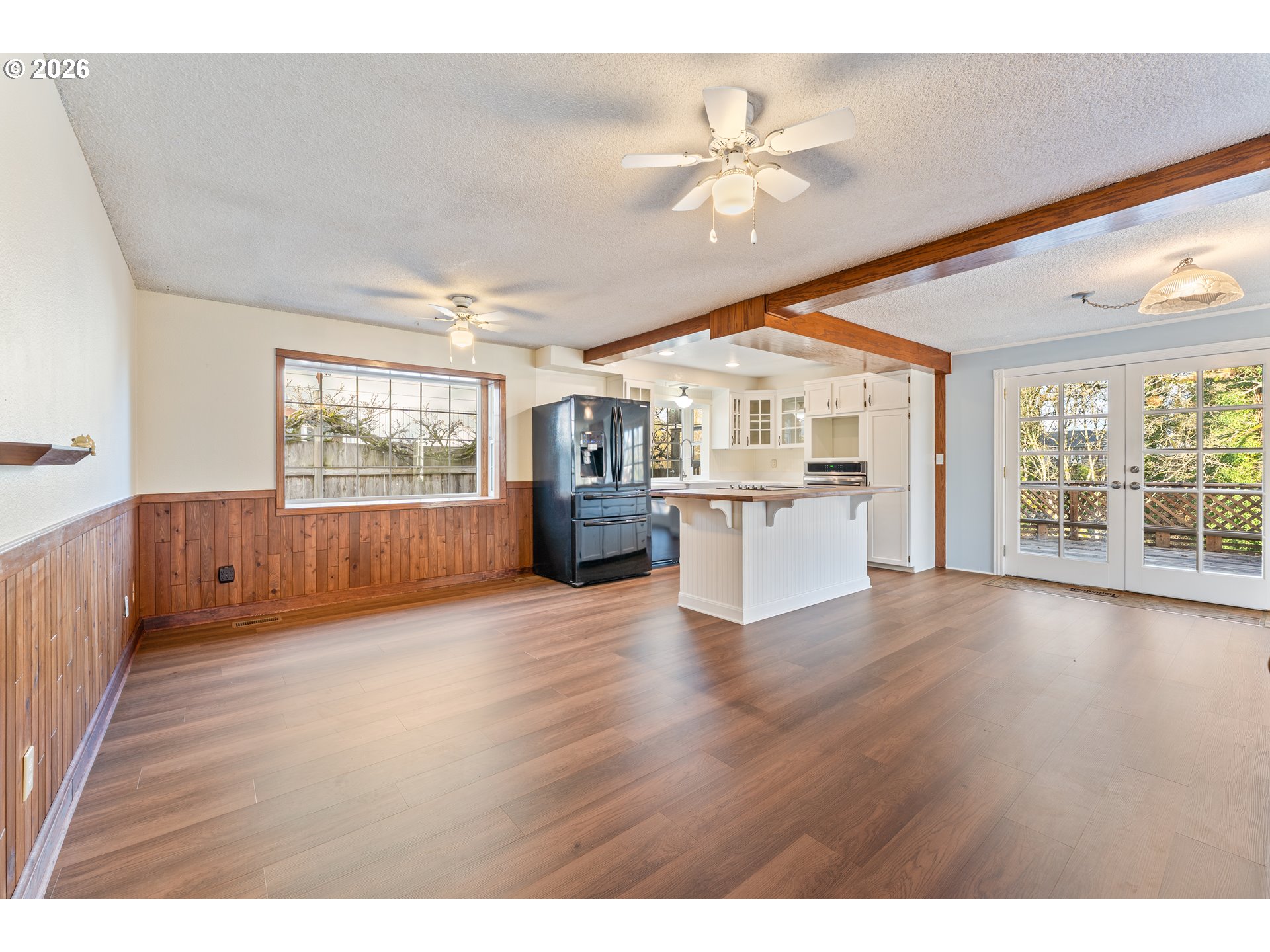 624 South 12th Street St. Helens, OR 97051 - Photo 18 of 45 a view of an empty room with a window and wooden floor