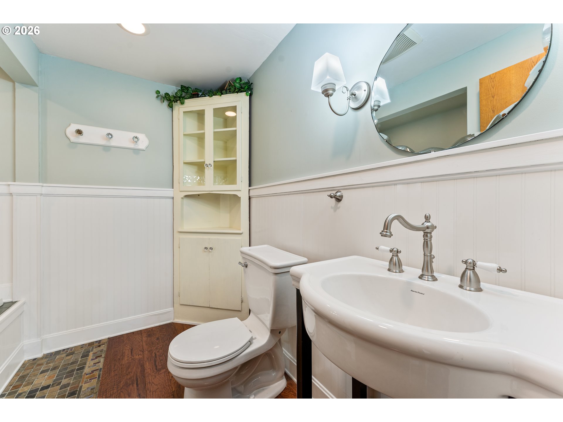 624 South 12th Street St. Helens, OR 97051 - Photo 26 of 45 a bathroom with a sink a toilet and a mirror