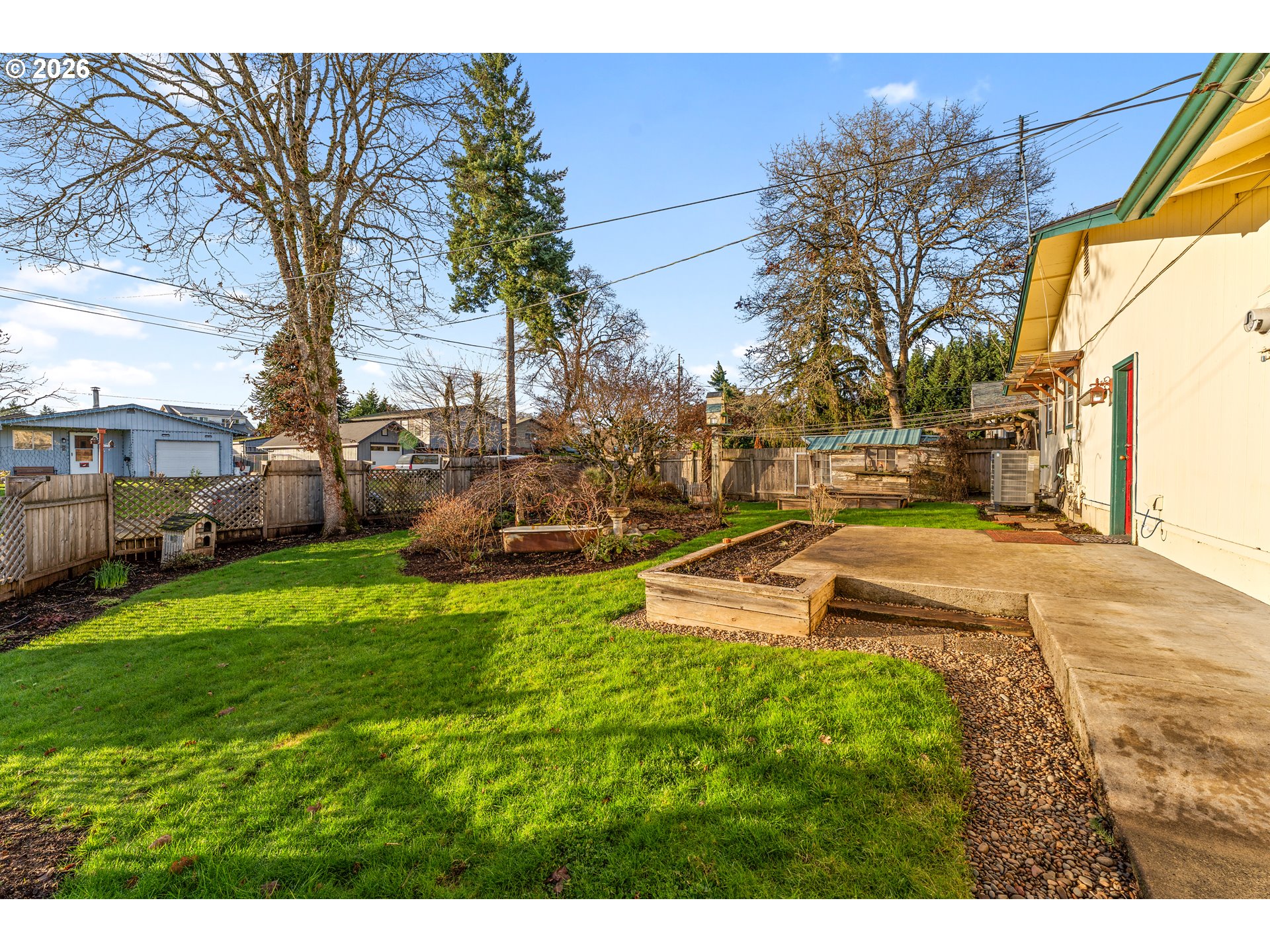 624 South 12th Street St. Helens, OR 97051 - Photo 33 of 45 a view of a swimming pool with a yard