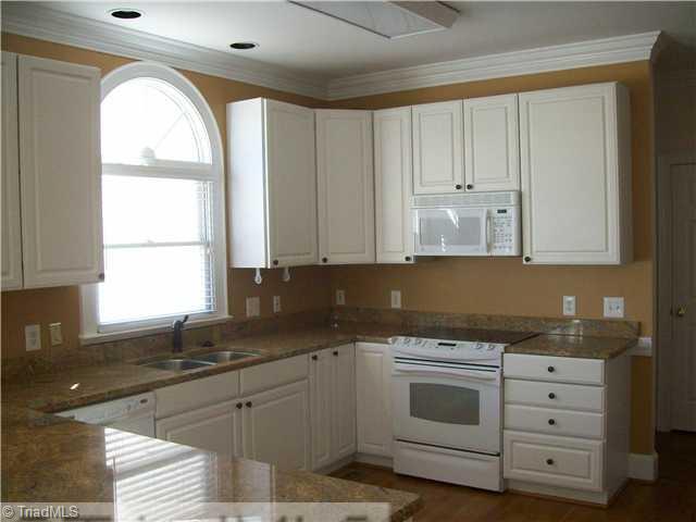 3009 Alamance Road Greensboro, NC 27407 - Photo 5 of 14 Kitchen. Kitchen with granite counters and hardwood floors