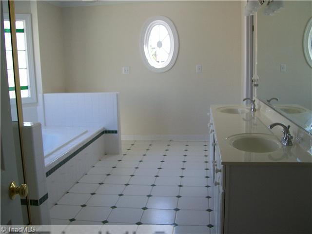 3009 Alamance Road Greensboro, NC 27407 - Photo 9 of 14 Master Bath/Spa. Master bath with jetted tub, seperate shower and double sinks.
