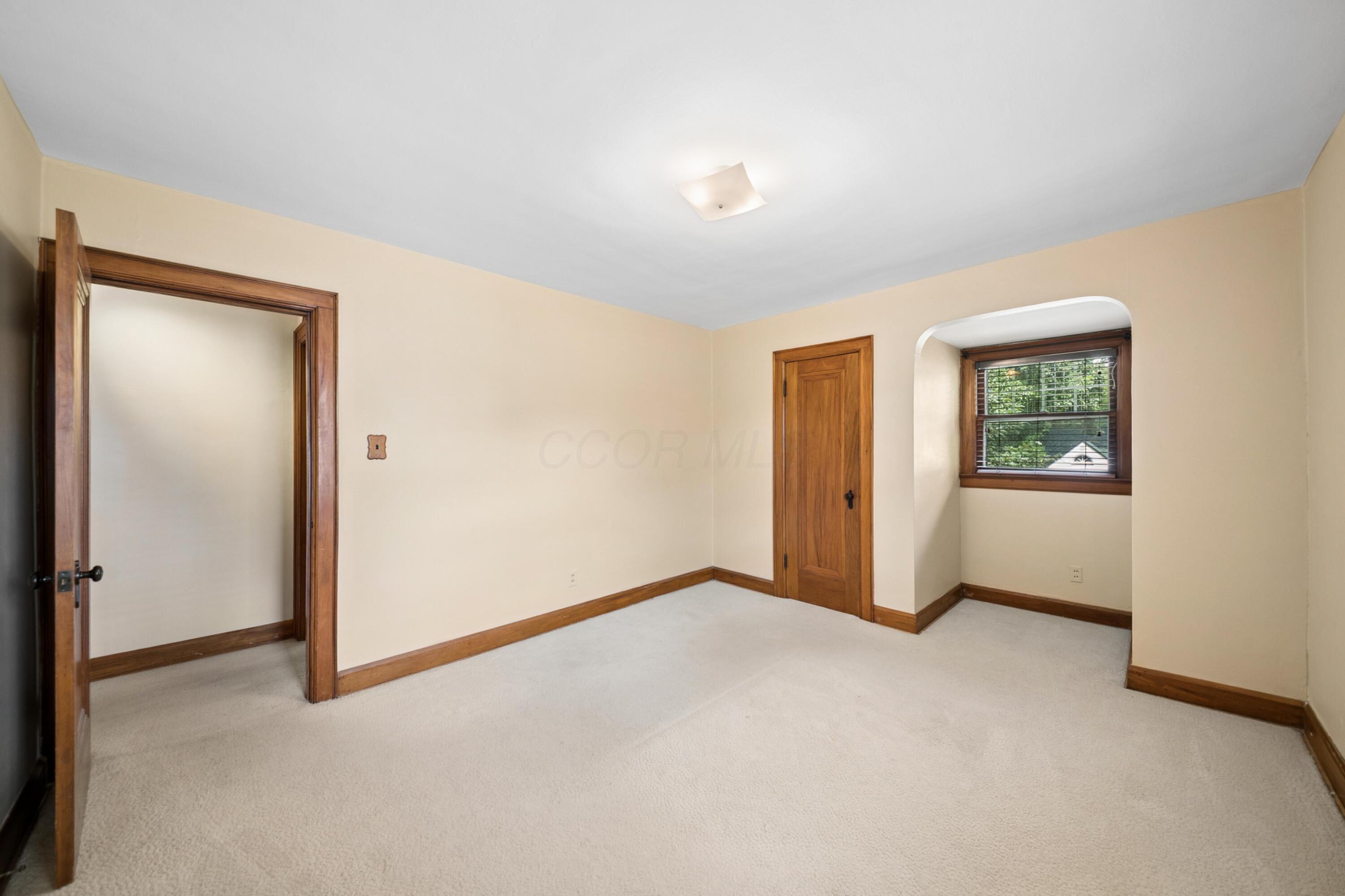 393 Mimring Road Columbus, OH 43202 - Photo 38 of 55 Bedroom 2. Large closet and wood floors under carpet