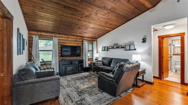 a kitchen with stainless steel appliances granite countertop a stove and a sink next to a large window