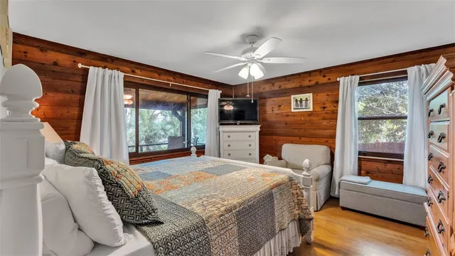 a view of walk in closet with clothes