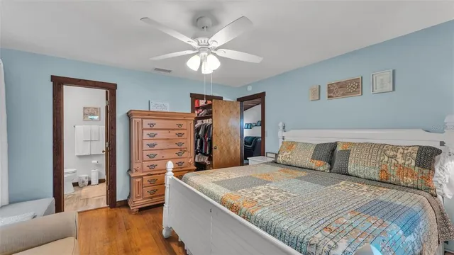 a bathroom with a toilet and shower