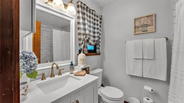 a vase of flowers sitting next to a window