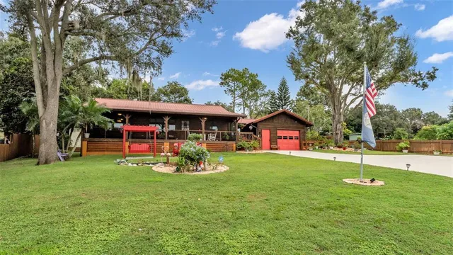 a view of a house with a yard porch and sitting area