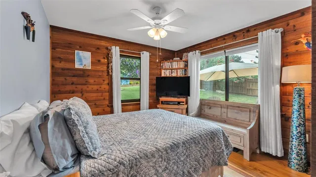 an aerial view of lake residential house with outdoor space and trees around