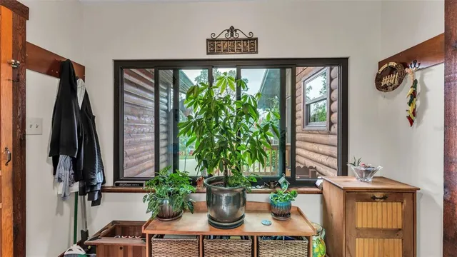 a view of a house with a yard patio and fire pit
