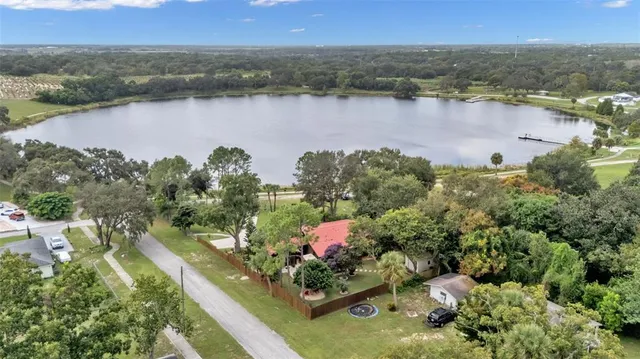 a view of an house with backyard space and garden