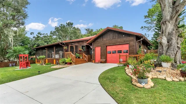 a view of a backyard with sitting area