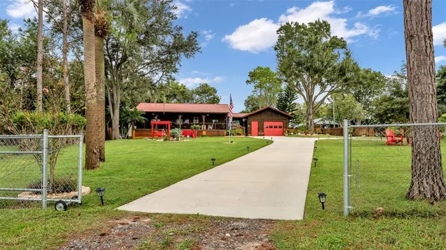 $395,000 | 219 East Lake Menzie Boulevard, Dundee, FL 33838