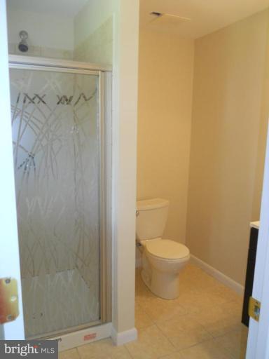 8820 Sigrid Road Randallstown, MD 21133 - Photo 15 of 23 a bathroom with a shower and a toilet