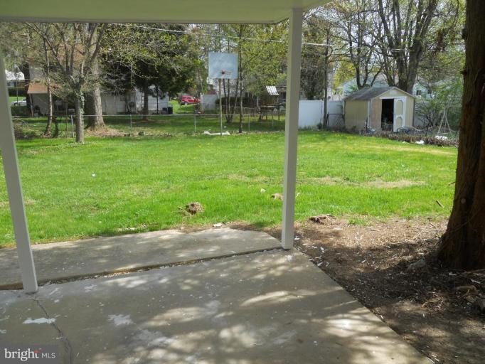 8820 Sigrid Road Randallstown, MD 21133 - Photo 16 of 23 a view of a house with a yard