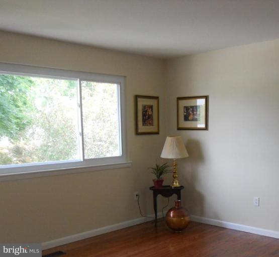 8820 Sigrid Road Randallstown, MD 21133 - Photo 23 of 23 a room with a window and flowerpot