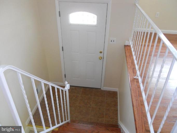 8820 Sigrid Road Randallstown, MD 21133 - Photo 6 of 23 a view of entryway with stairs