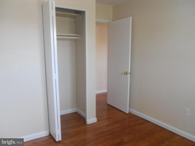 8820 Sigrid Road Randallstown, MD 21133 - Photo 10 of 23 an empty room with wooden floor & closet